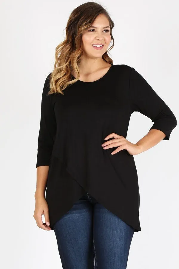 Loose fit three quarter sleeve solid tunic top with waist length overlap hem